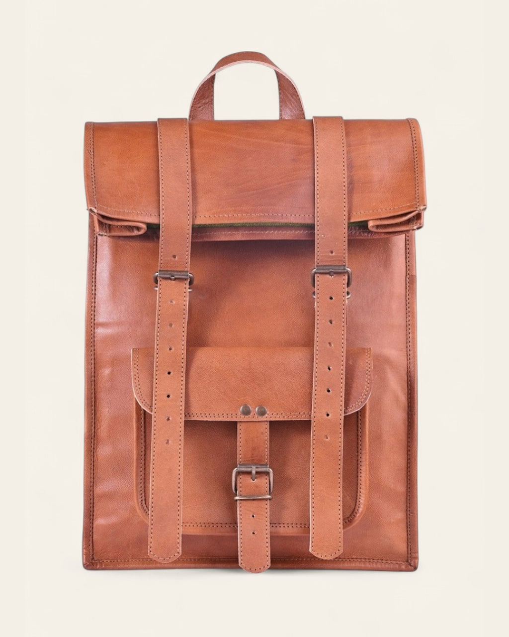 The Sariska Backpack — tall handcrafted tan real leather fold-over rucksack by Jeengar, front view