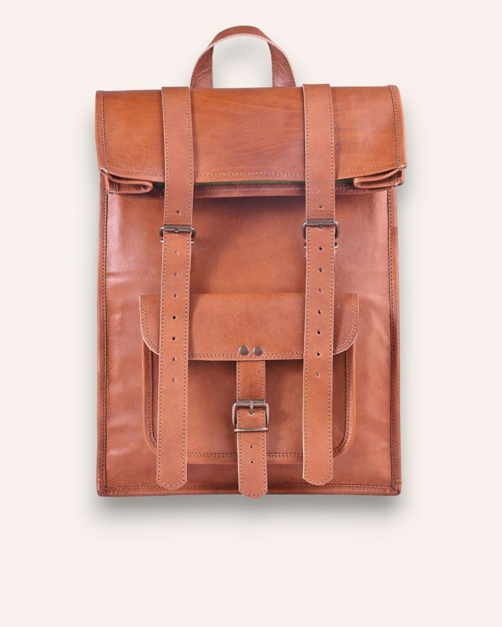 The Sariska Backpack, a tall 20-inch handcrafted tan goat leather fold-over rucksack with dual vertical straps by Jeengar.