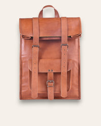 The Sariska Backpack, a tall 20-inch handcrafted tan goat leather fold-over rucksack with dual vertical straps by Jeengar.