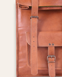 The Sariska Backpack, a tall 20-inch handcrafted tan goat leather fold-over rucksack with dual vertical straps by Jeengar.