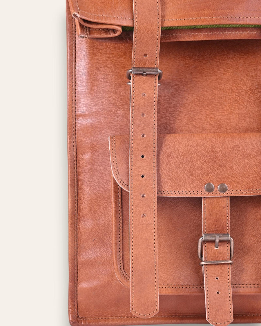 The Sariska Backpack, a tall 20-inch handcrafted tan goat leather fold-over rucksack with dual vertical straps by Jeengar.