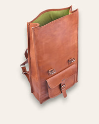 The Sariska Backpack, a tall 20-inch handcrafted tan goat leather fold-over rucksack with dual vertical straps by Jeengar.