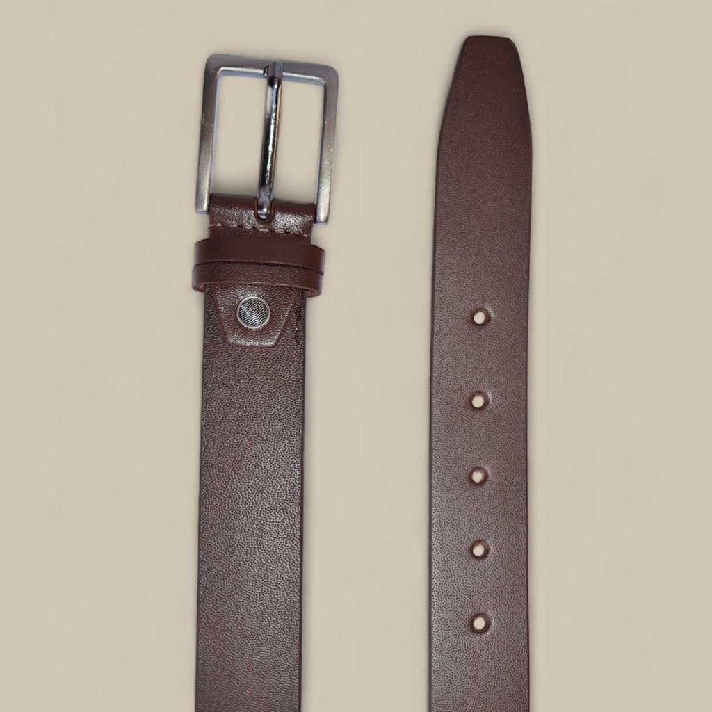 Brown leather belt with silver buckle on a beige background
