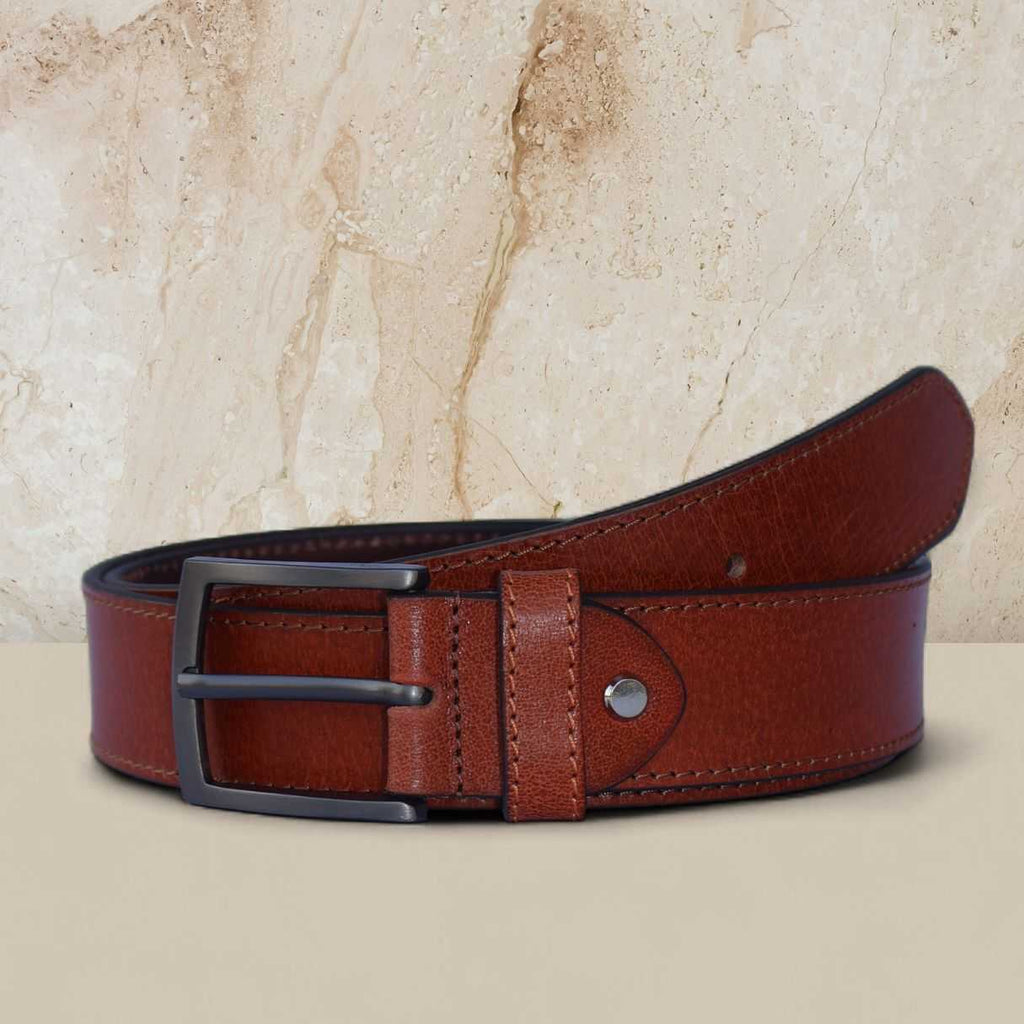 Brown leather belt with a black buckle on a beige background
