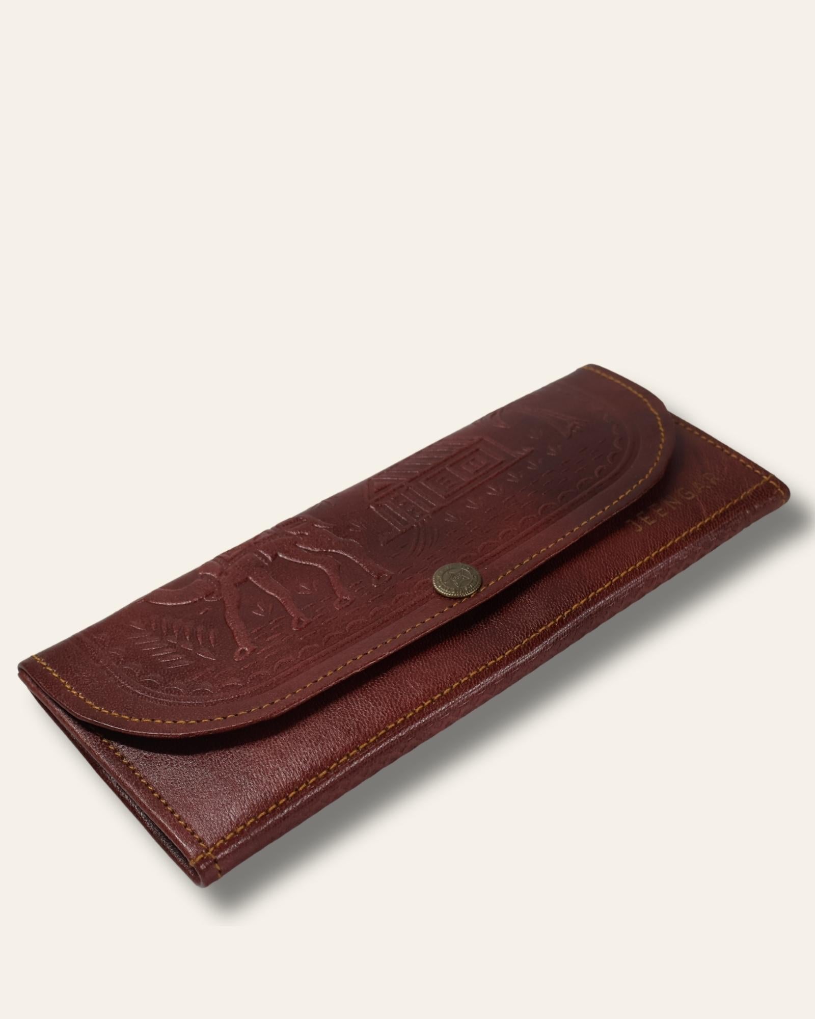 A real leather Ladies clutch or purse in cherry red color