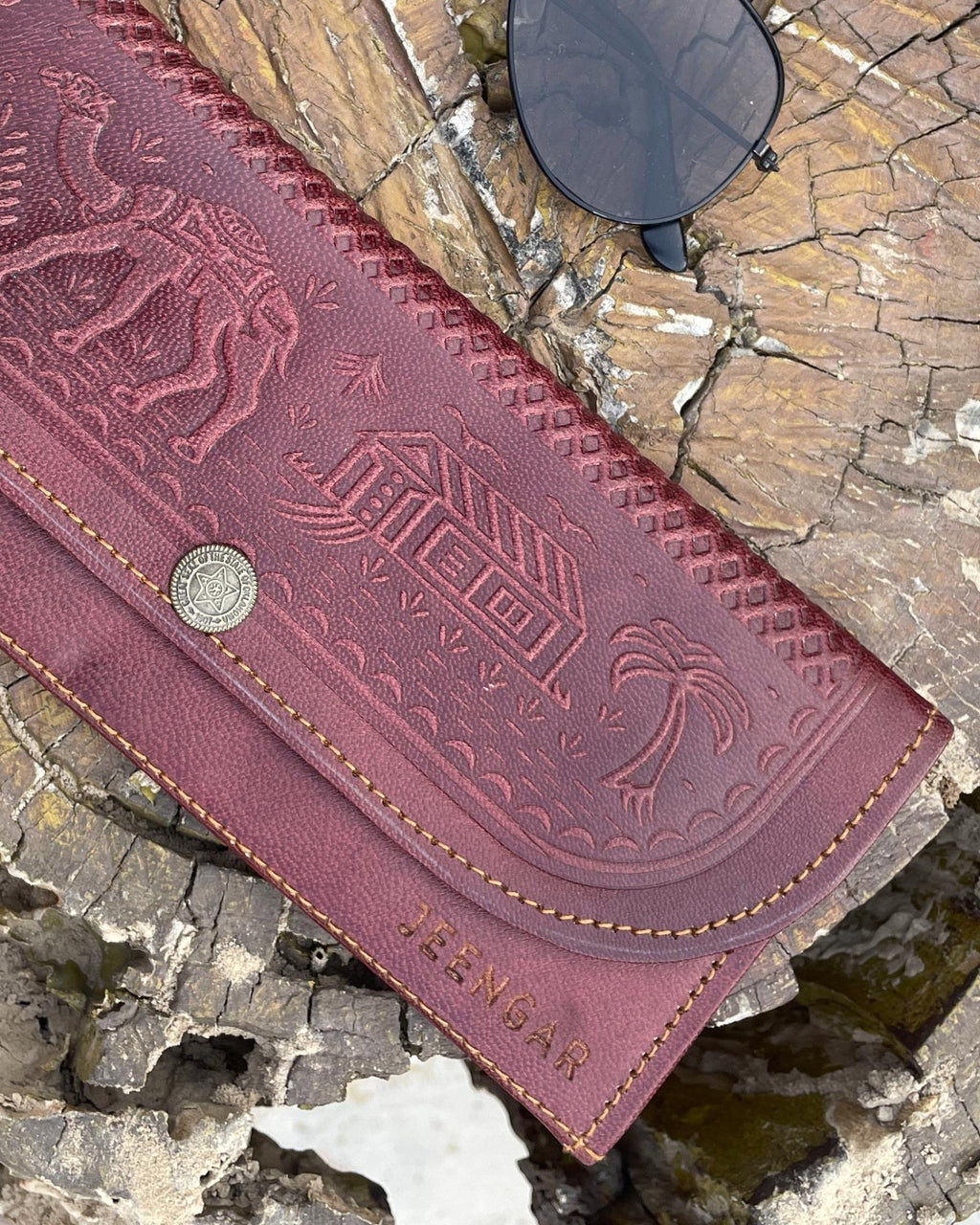 A real leather Ladies clutch or purse in cherry red color