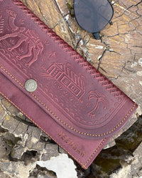 A real leather Ladies clutch or purse in cherry red color