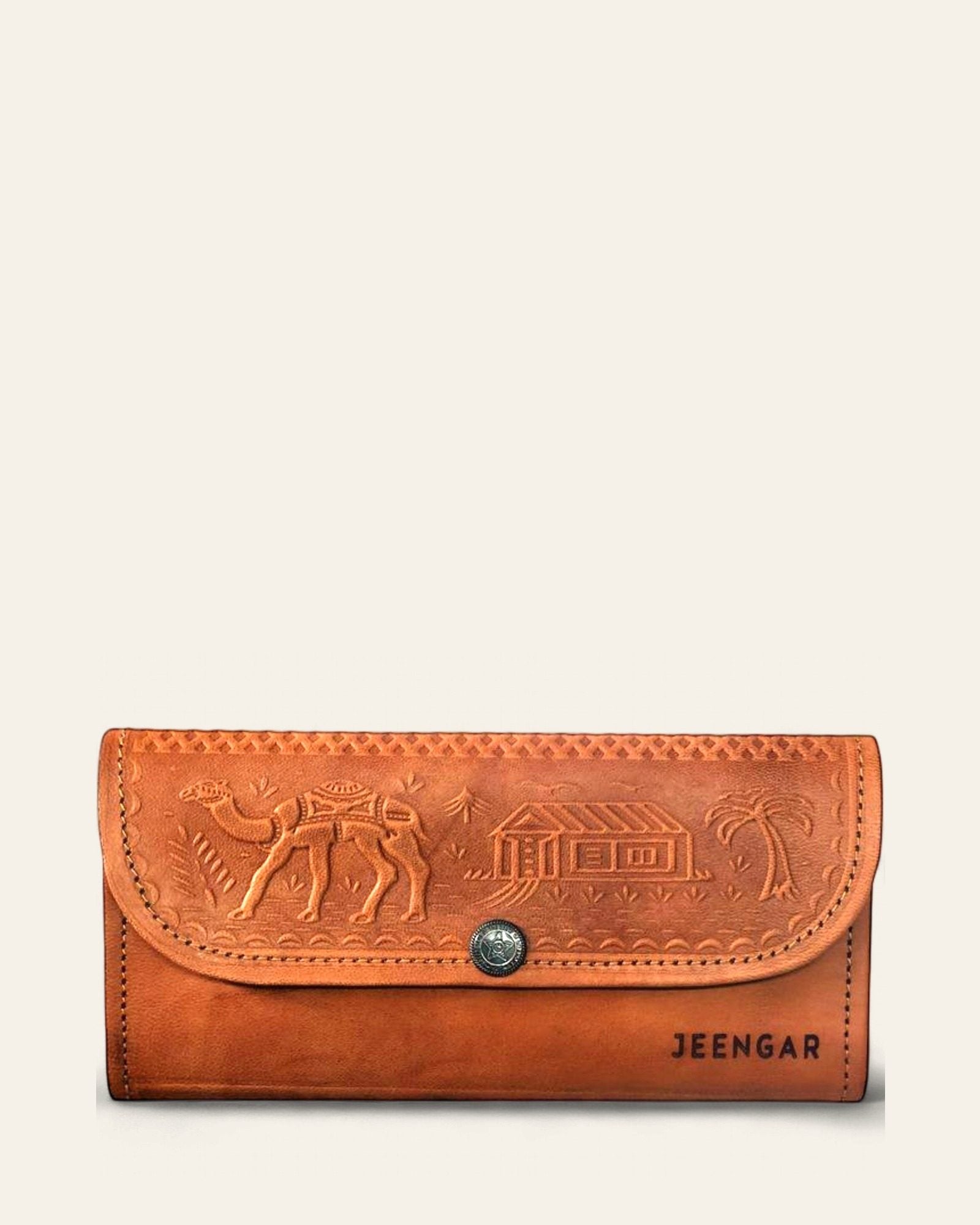 Tan certified leather clutch, front with embossed Rajasthani camel motif — Jeengar
