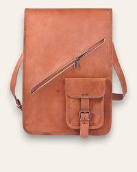 The Bundi Crossbody Bag, a tall handcrafted tan goat leather bag featuring a diagonal zipper