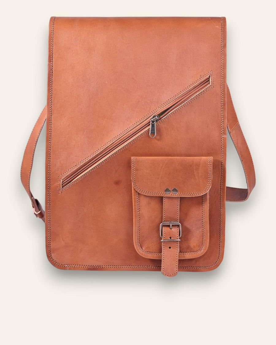 The Bundi Crossbody Bag, a tall handcrafted tan goat leather bag featuring a diagonal zipper