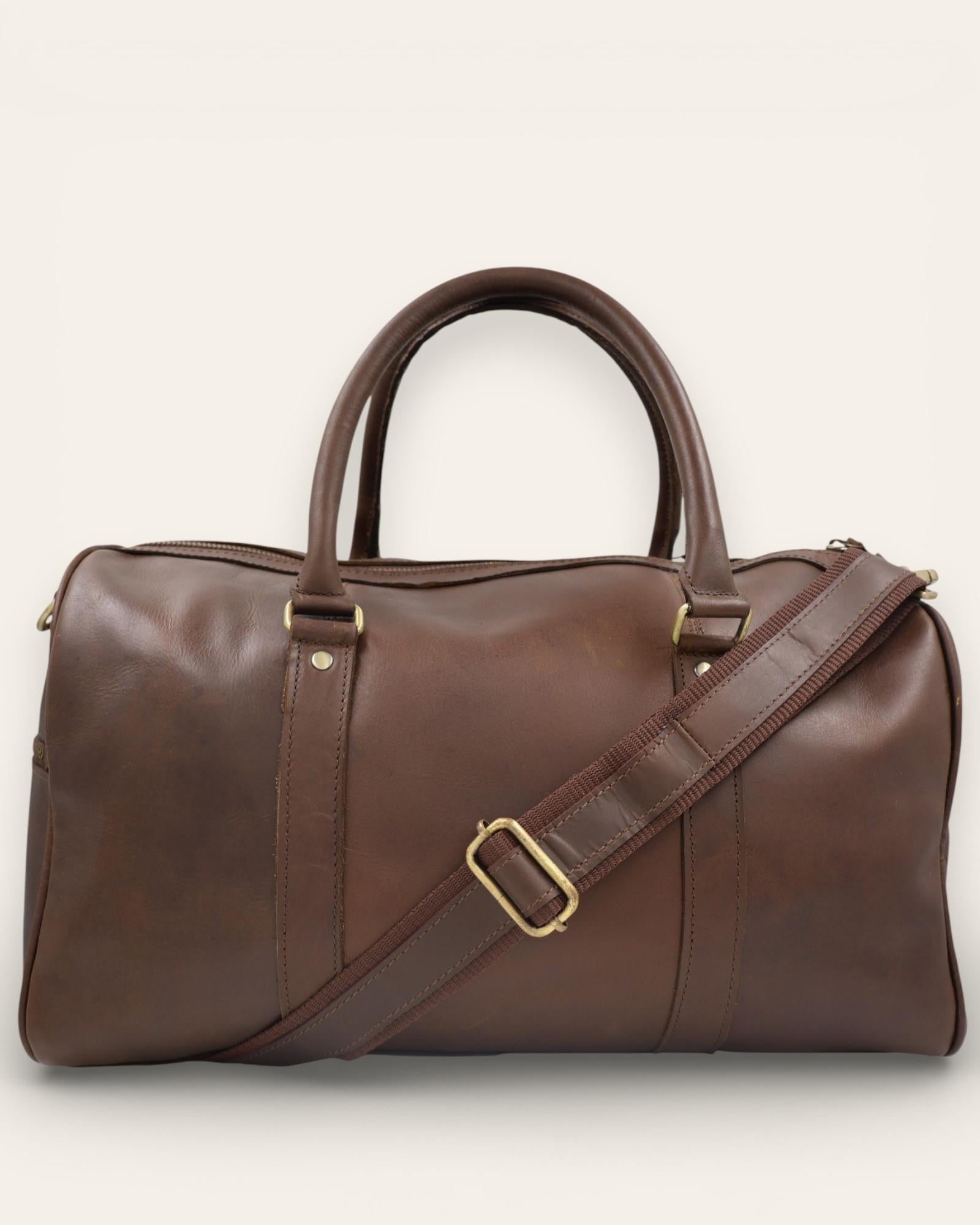Classic, vintage, hunter leather duffel bag in dark brown color