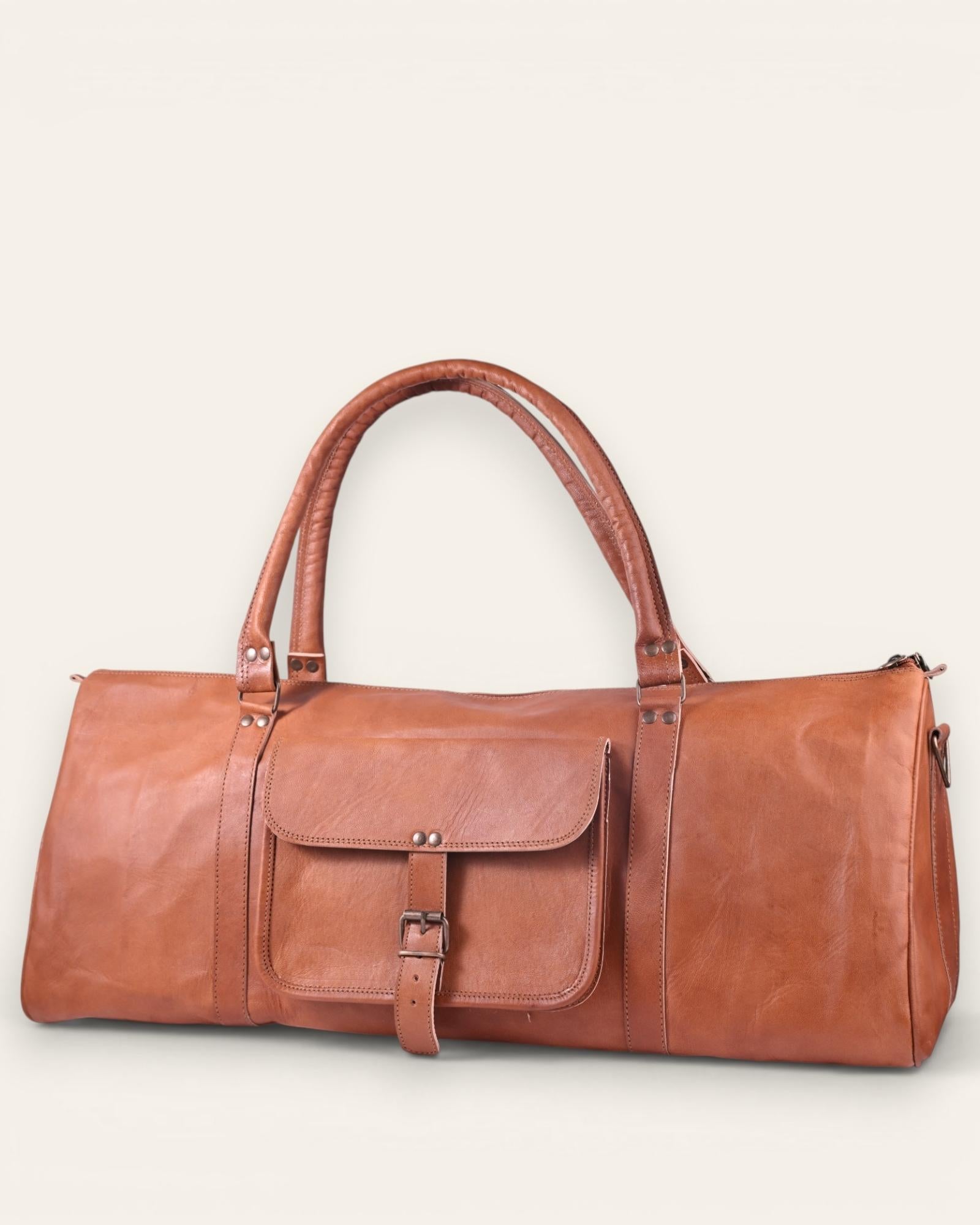 A triangle shapped duffel bag in real tan leather color