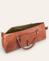 A triangle shapped duffel bag in real tan leather color