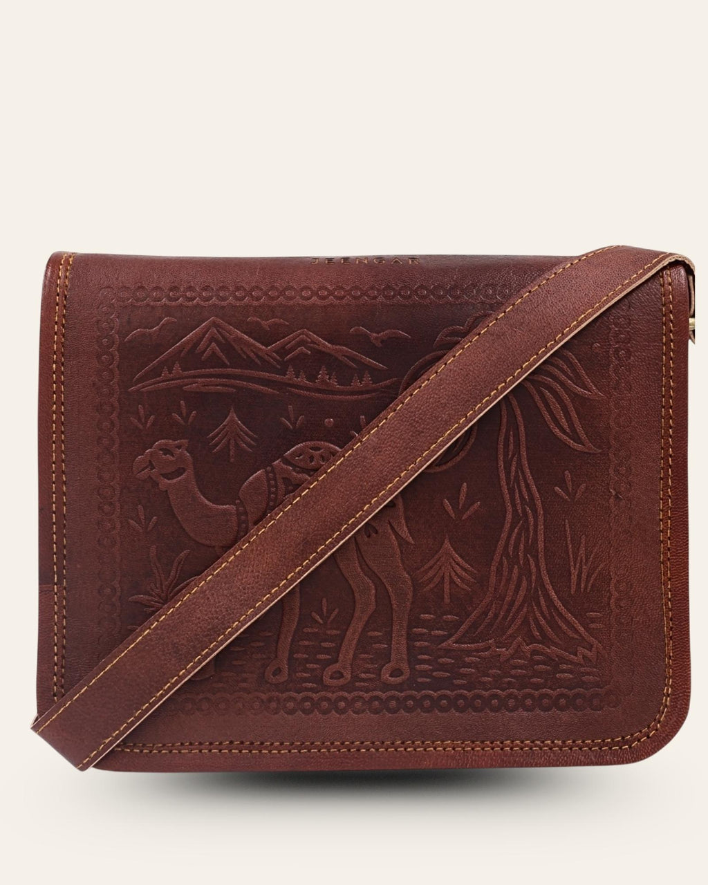 a cherry color real leather sling bag. Handmade in rajasthan