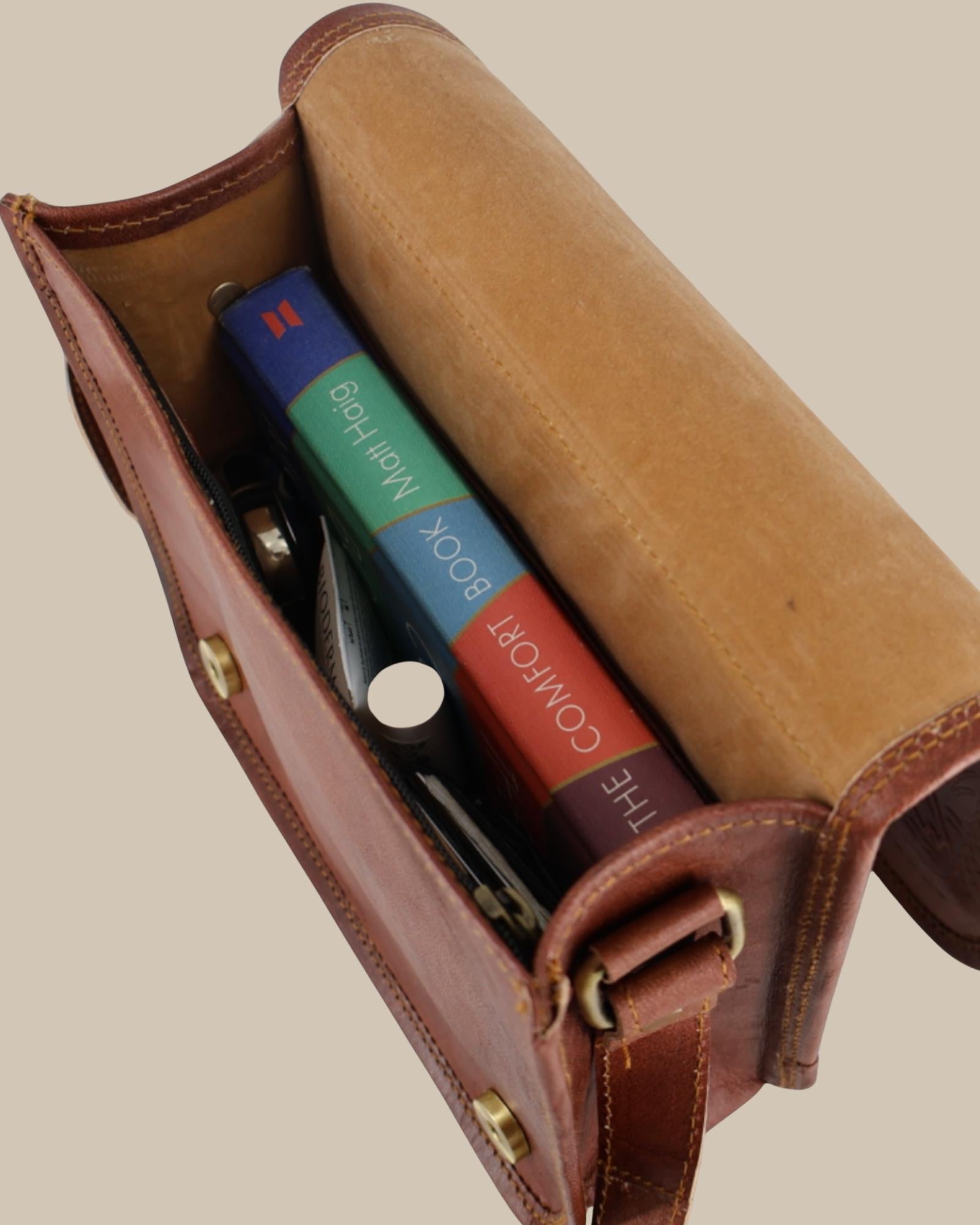 a cherry color real leather sling bag. Handmade in rajasthan