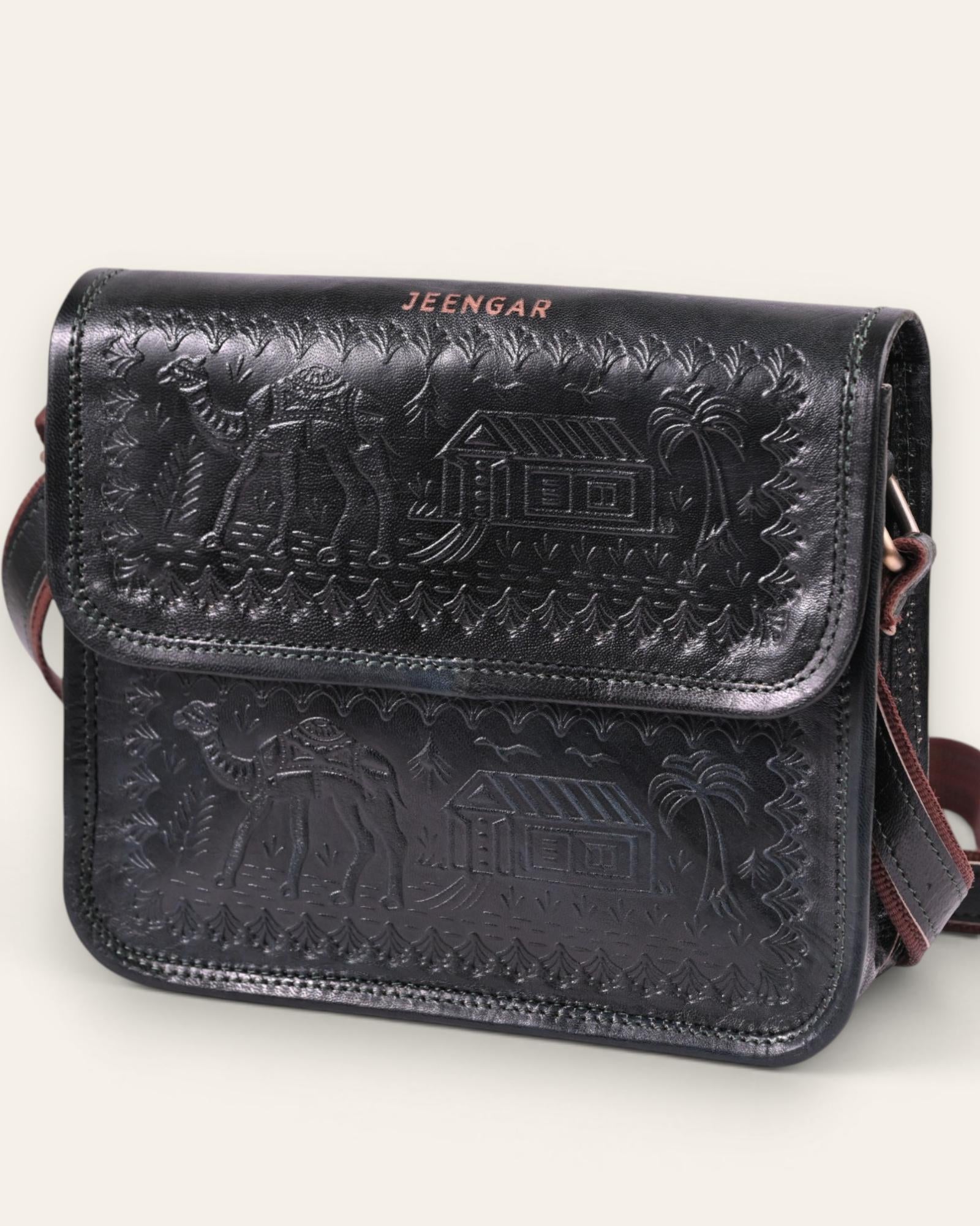 A dark green real leather sling bag handmade by jeengar artisans