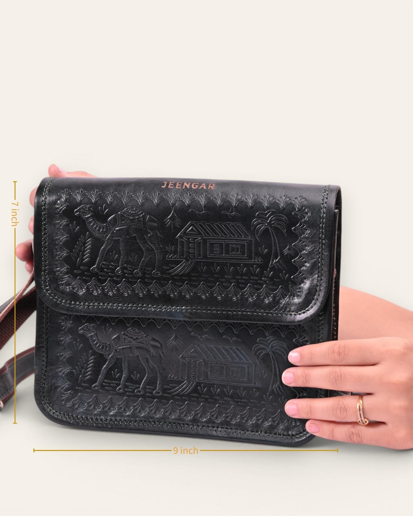 A dark green real leather sling bag handmade by jeengar artisans