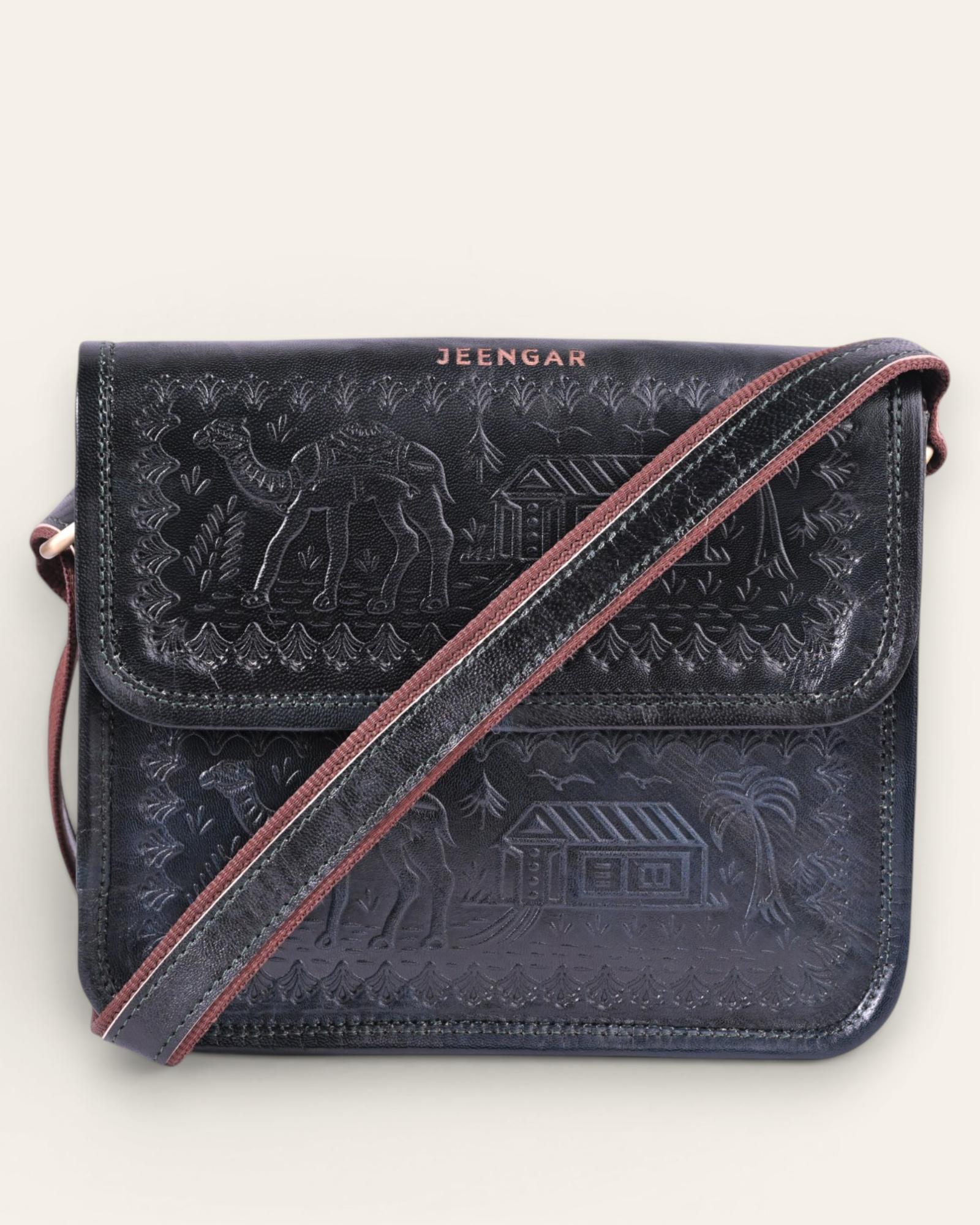 A dark green real leather sling bag handmade by jeengar artisans
