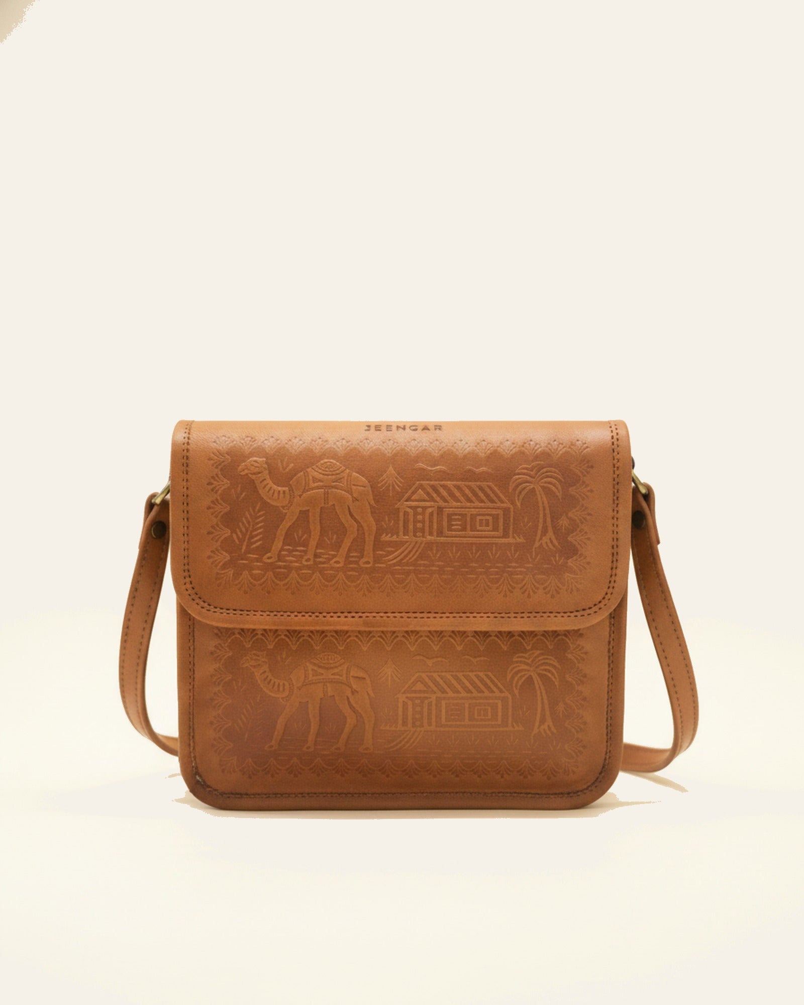 The Pushkar Sling in Tan — heritage embossed leather cross-body