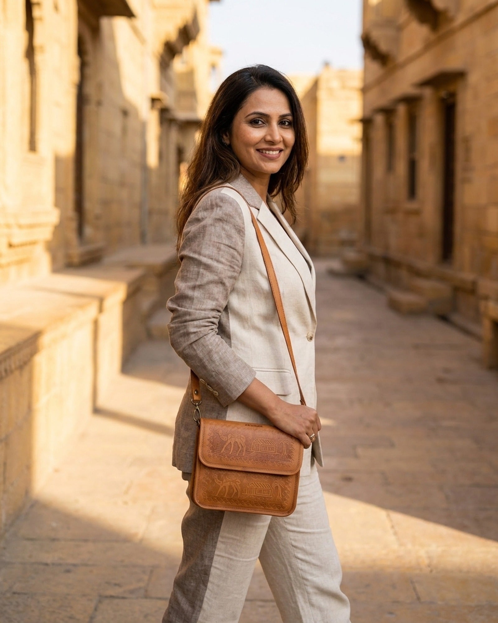 The Pushkar Sling in Tan worn crossbody on a Jaisalmer street