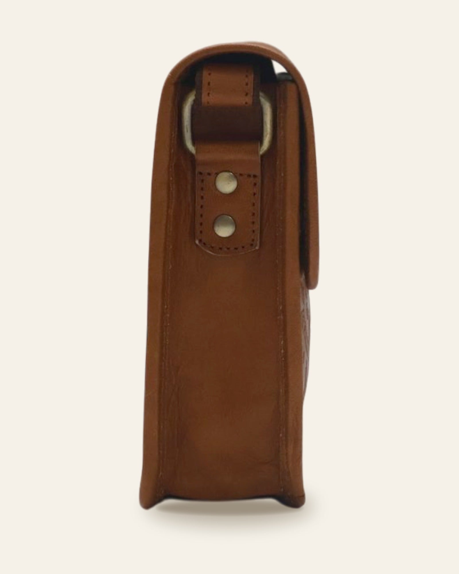 The Pushkar Sling in Tan — side profile with brass D-ring