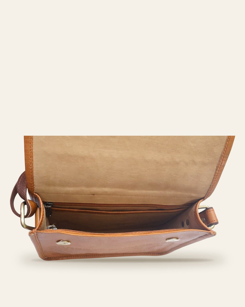 The Pushkar Sling in Tan — open interior with velvet lining and zip pocket