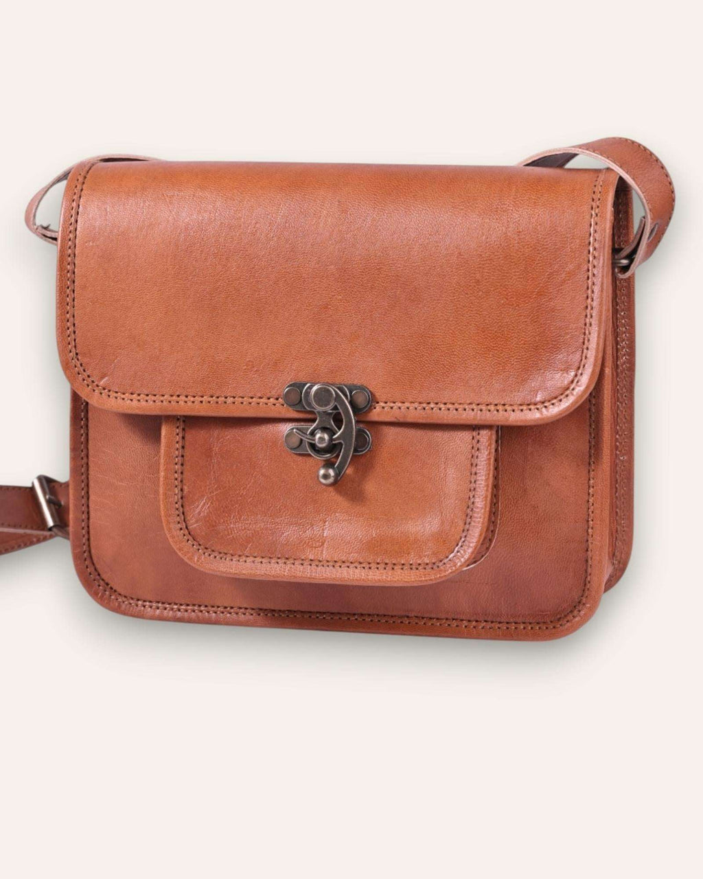 A real leather sling bag in tan color
