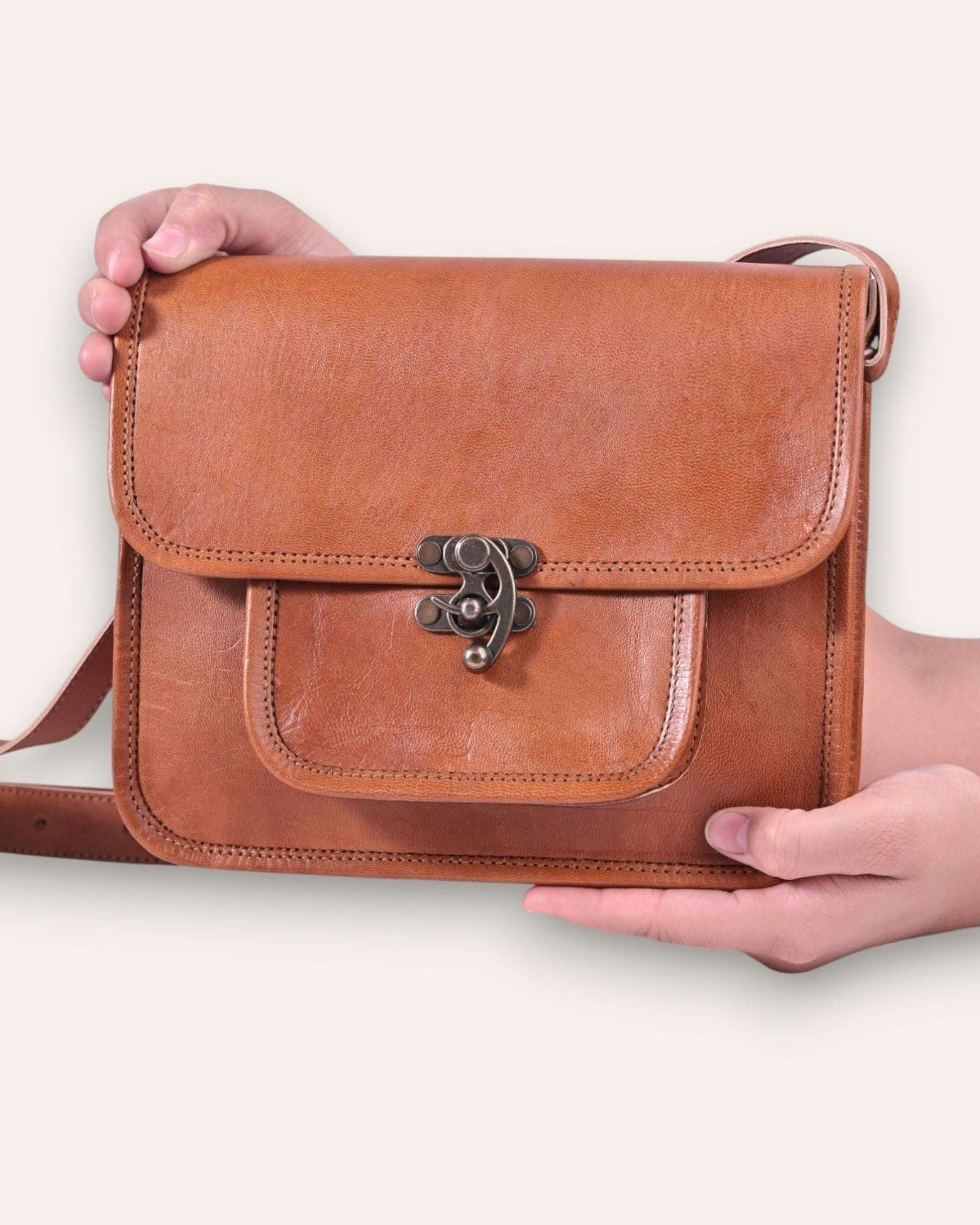 A real leather sling bag in tan color