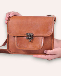 A real leather sling bag in tan color