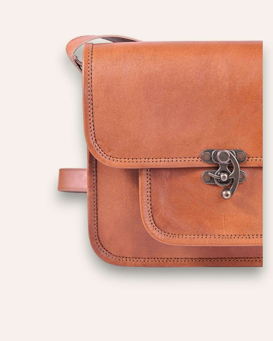 A real leather sling bag in tan color