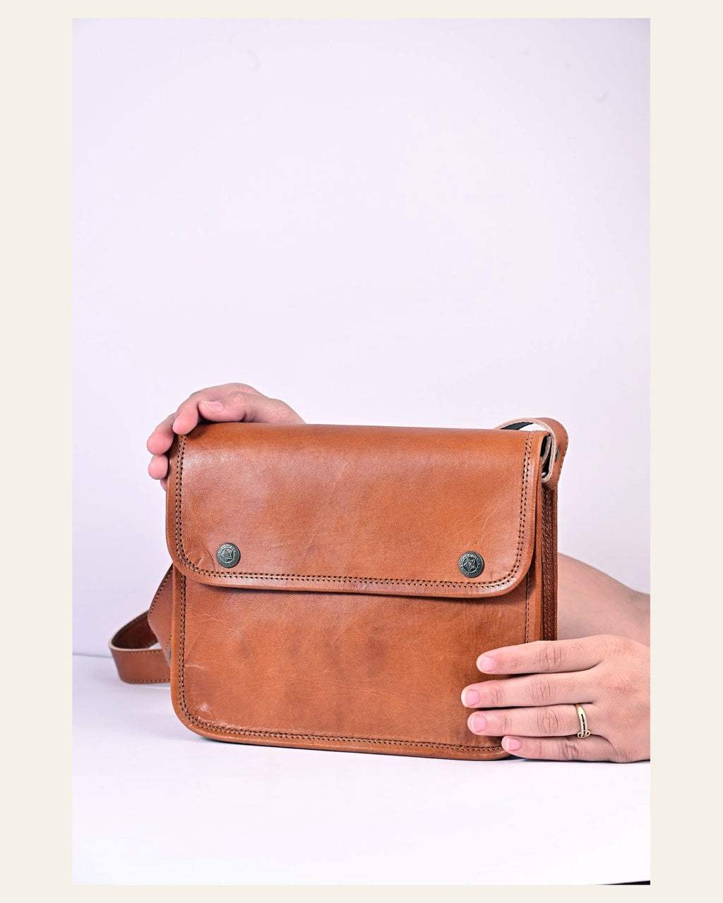 The Deogarh Sling held in hand to show its compact everyday scale