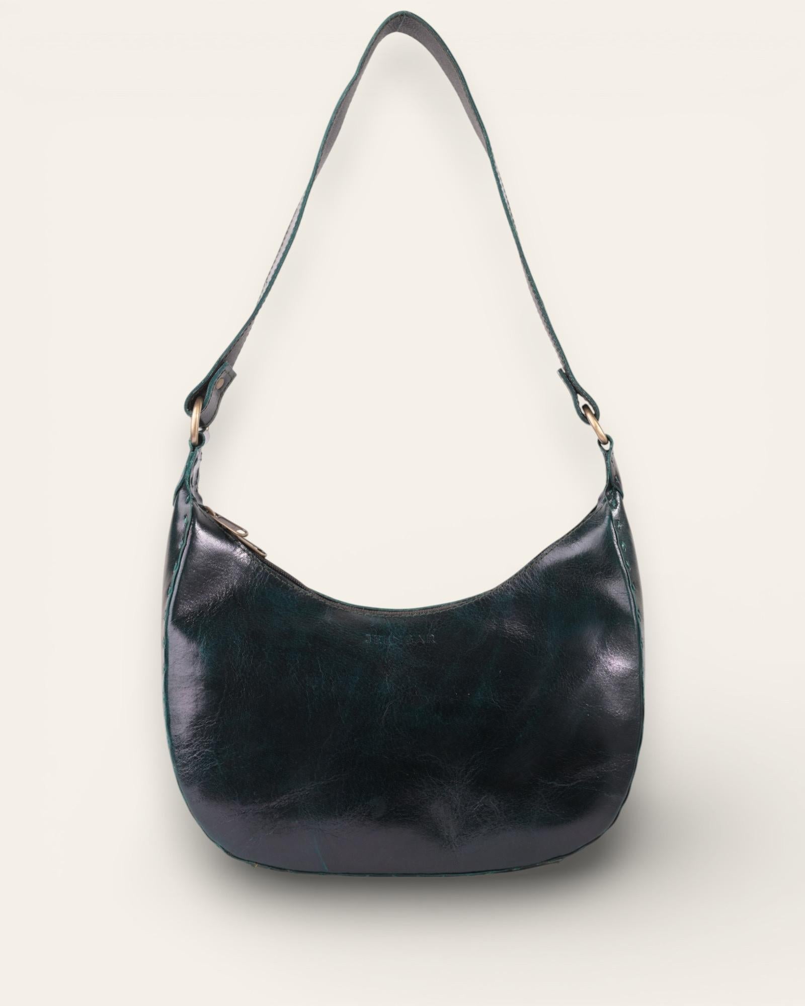 A dark green color real leather shoulder bag. It's spacious and beautiful.