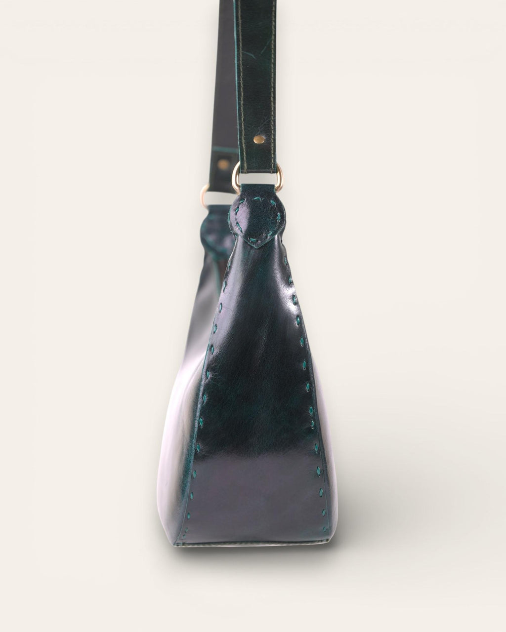 A dark green color real leather shoulder bag. It's spacious and beautiful.