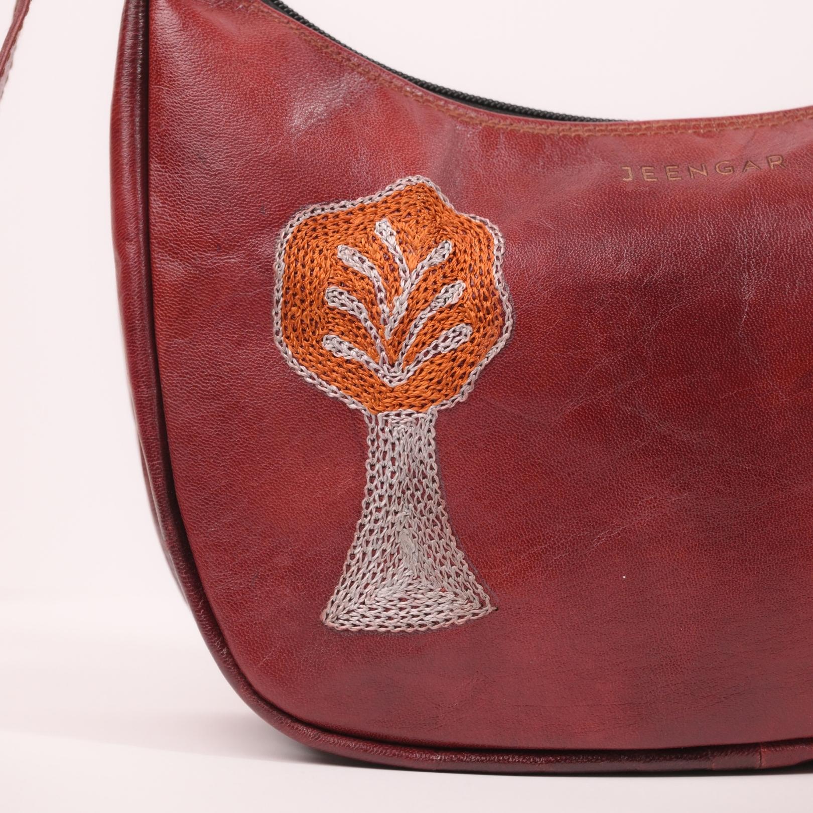 lose-up of the hand-embroidered Tree of Life detail on the Padmini leather shoulder bag.