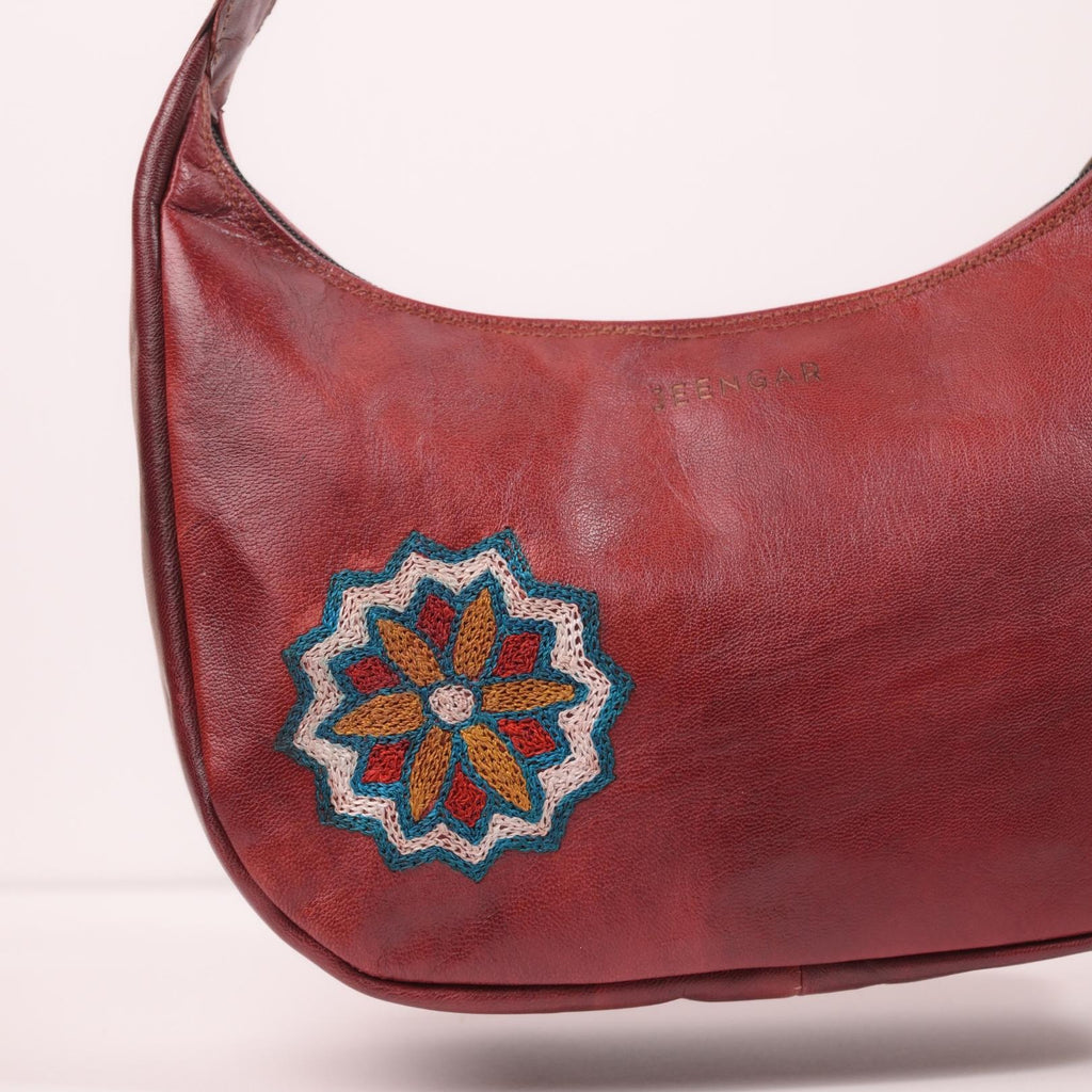Close-up of the intricate medallion embroidery on the Hadi leather shoulder bag.