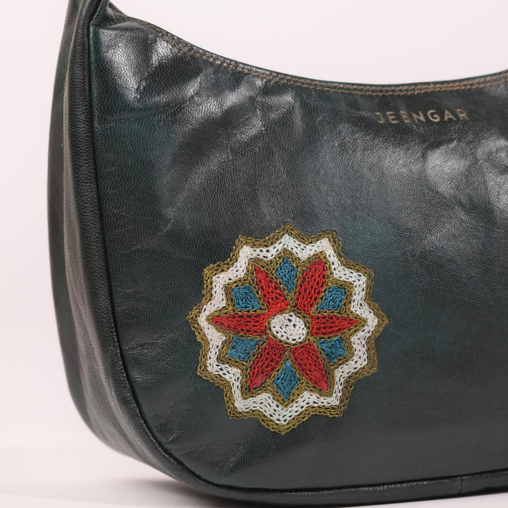 Close-up of the intricate medallion embroidery on the Hadi leather shoulder bag.