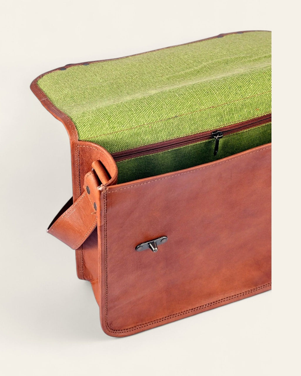 The Ajmer Laptop Bag, Twist-Lock style — open, showing canvas-lined laptop compartment