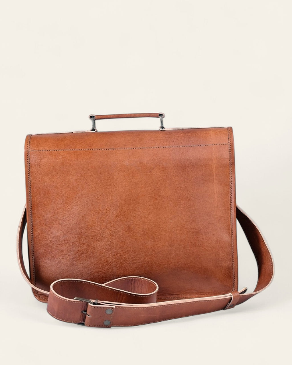 The Ajmer Laptop Bag, Twist-Lock style — back view with top carry handle