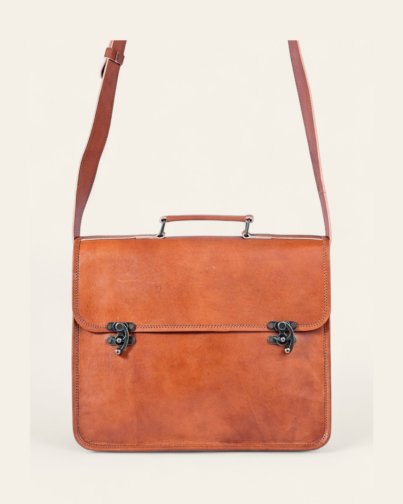 The Ajmer Laptop Bag, Twist-Lock style — full view with extended shoulder strap