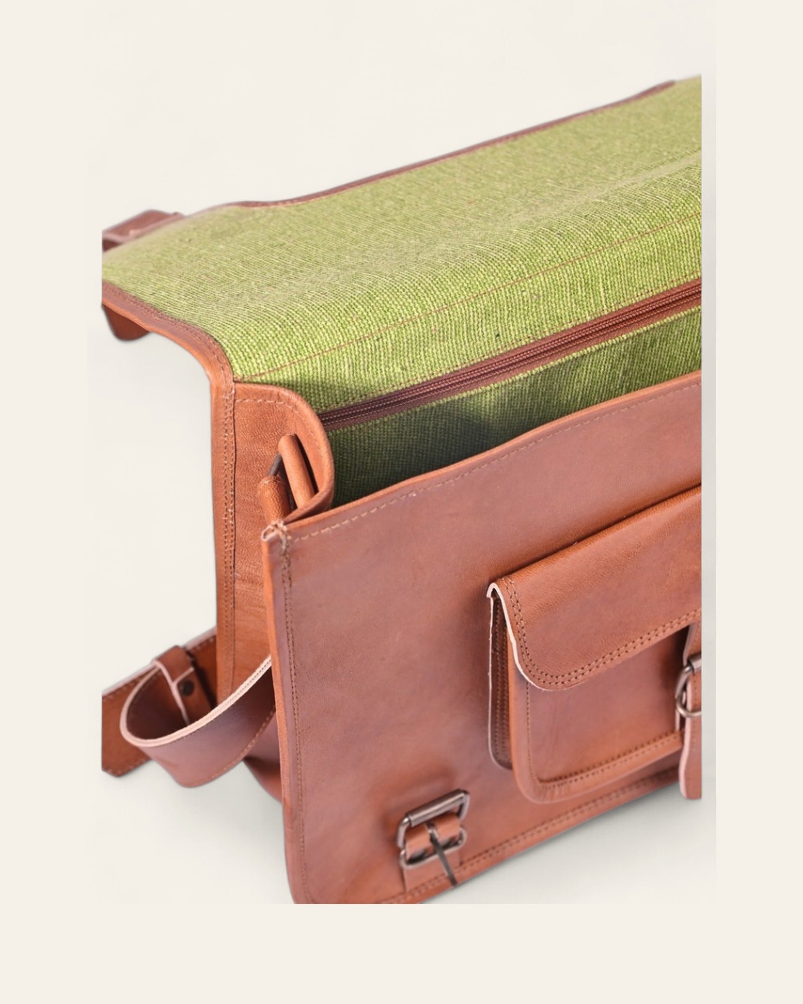 The Kota Laptop Bag open, revealing its bright-green canvas interior