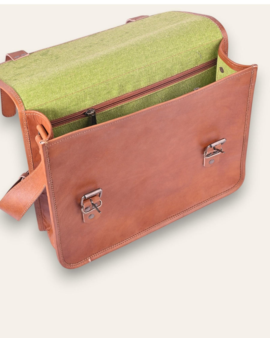 The Umaid Briefcase, a 15-inch handcrafted tan goat leather laptop bag with a no top handle and dual brass clasps by Jeengar.