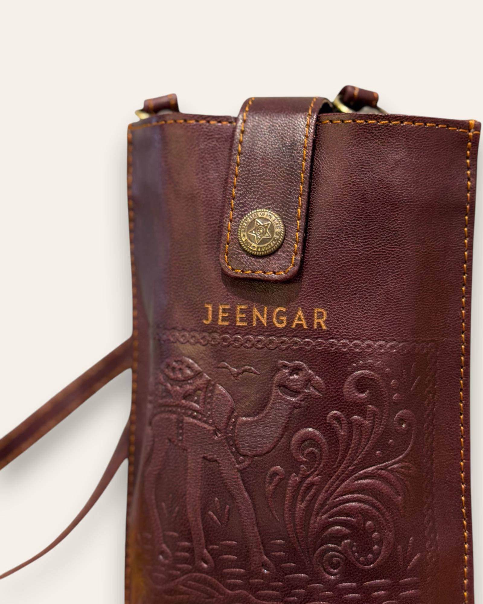 The Osian Mobile Sling — cherry red leather mobile sling, detail