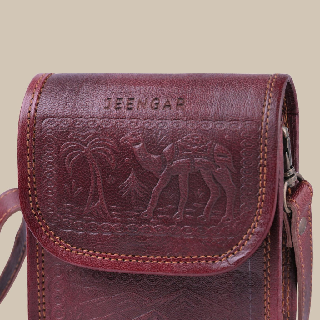 Cherry color handmade mobile leather sling bag. 