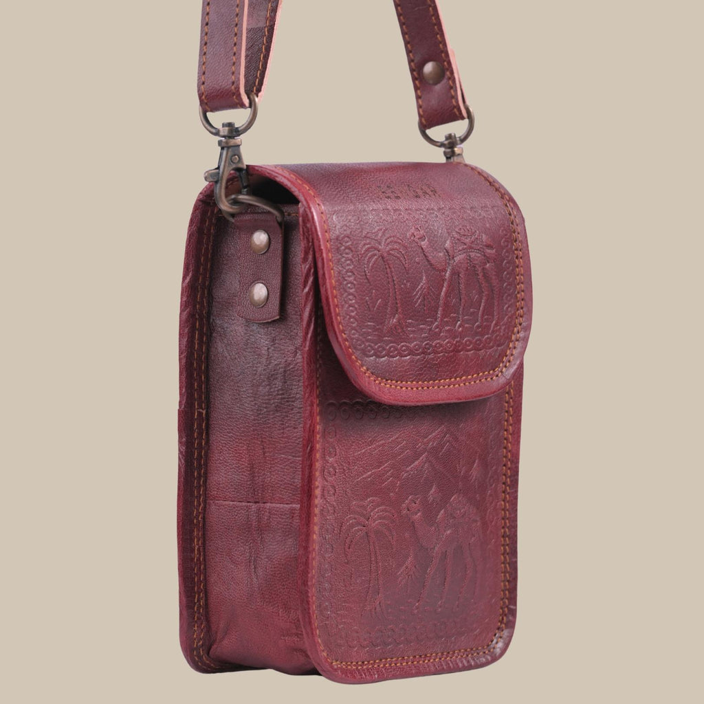 Cherry color handmade mobile leather sling bag. 