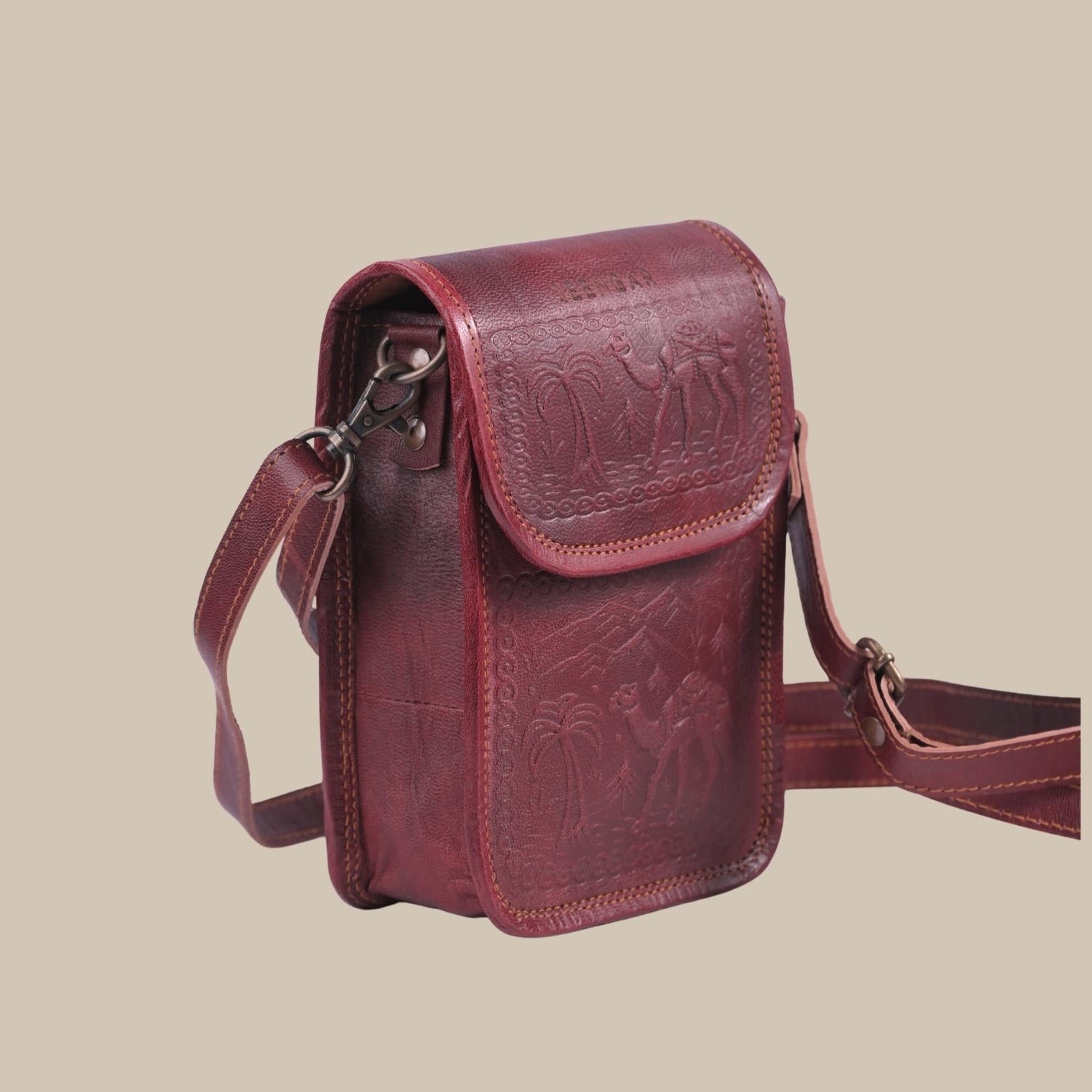 Cherry color handmade mobile leather sling bag. 