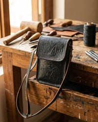 A compact mobile sling bag made with real leather, ideal for daily use
