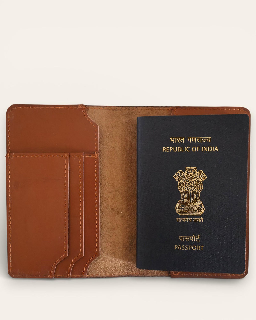 A real leather passport holder in brown color with multiple card slots and a cash slot