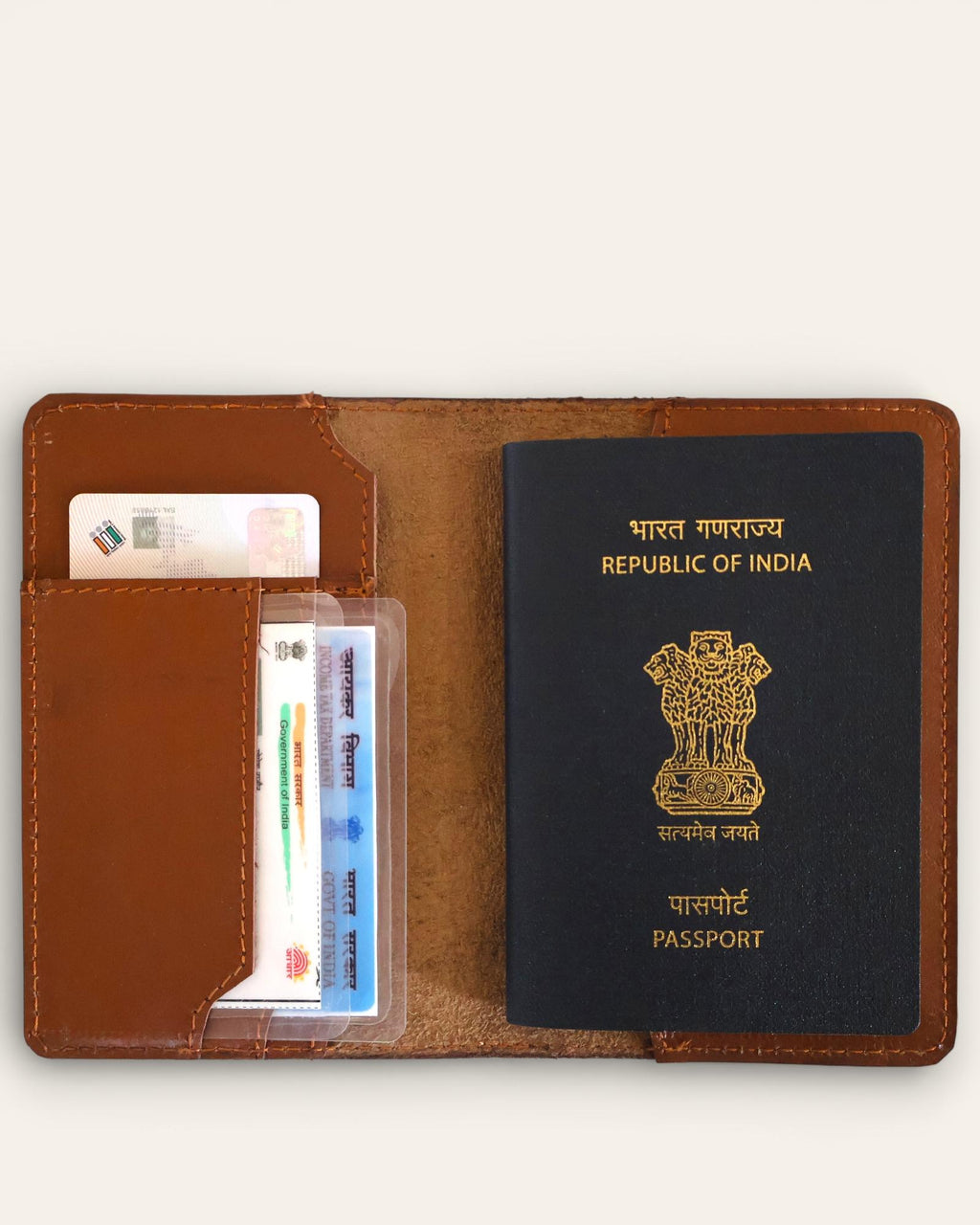 A real leather passport holder in brown color with multiple card slots and a cash slot