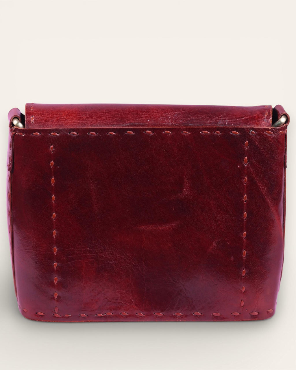 A red glossy small real leather sling bag, perfect for daily essentials