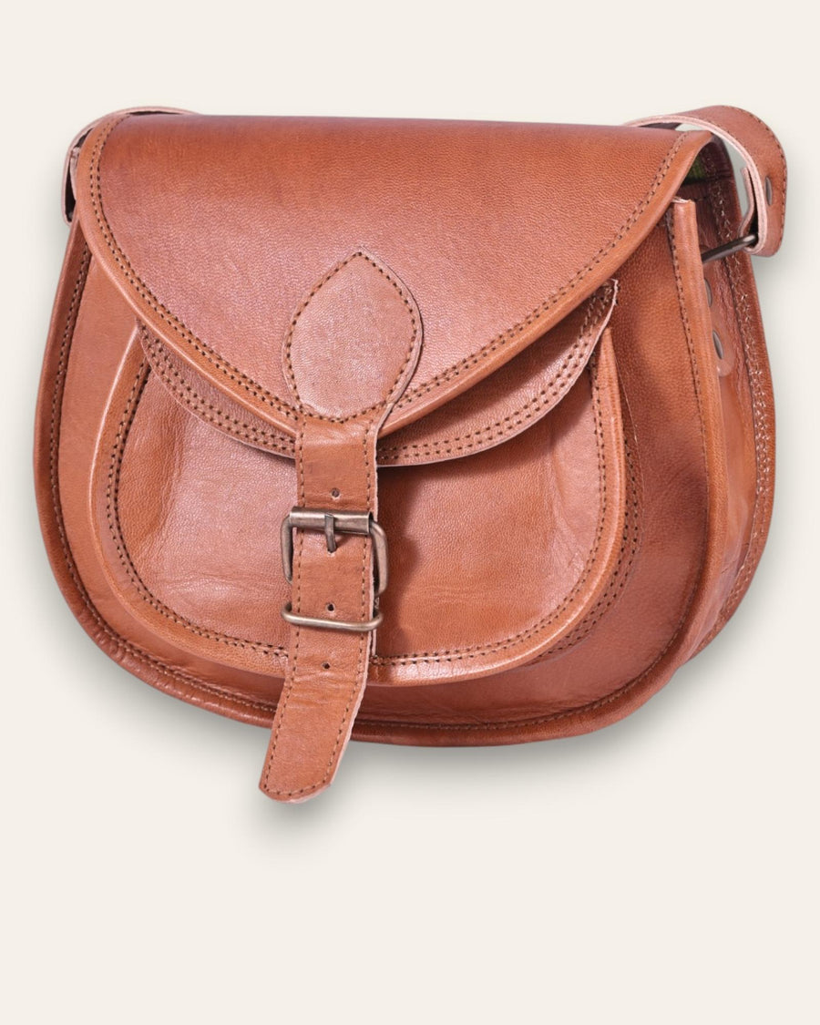 A real leather brown tan sling saddle bag for women and men